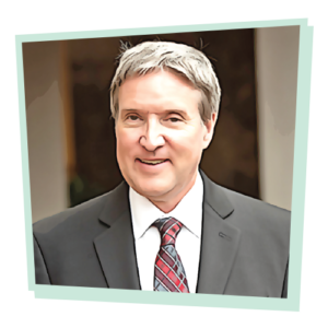 Photograph of Dale Atkinson, styled to look like a comic illustration. The image is surrounded by a mint-green, asymmetrical frame,